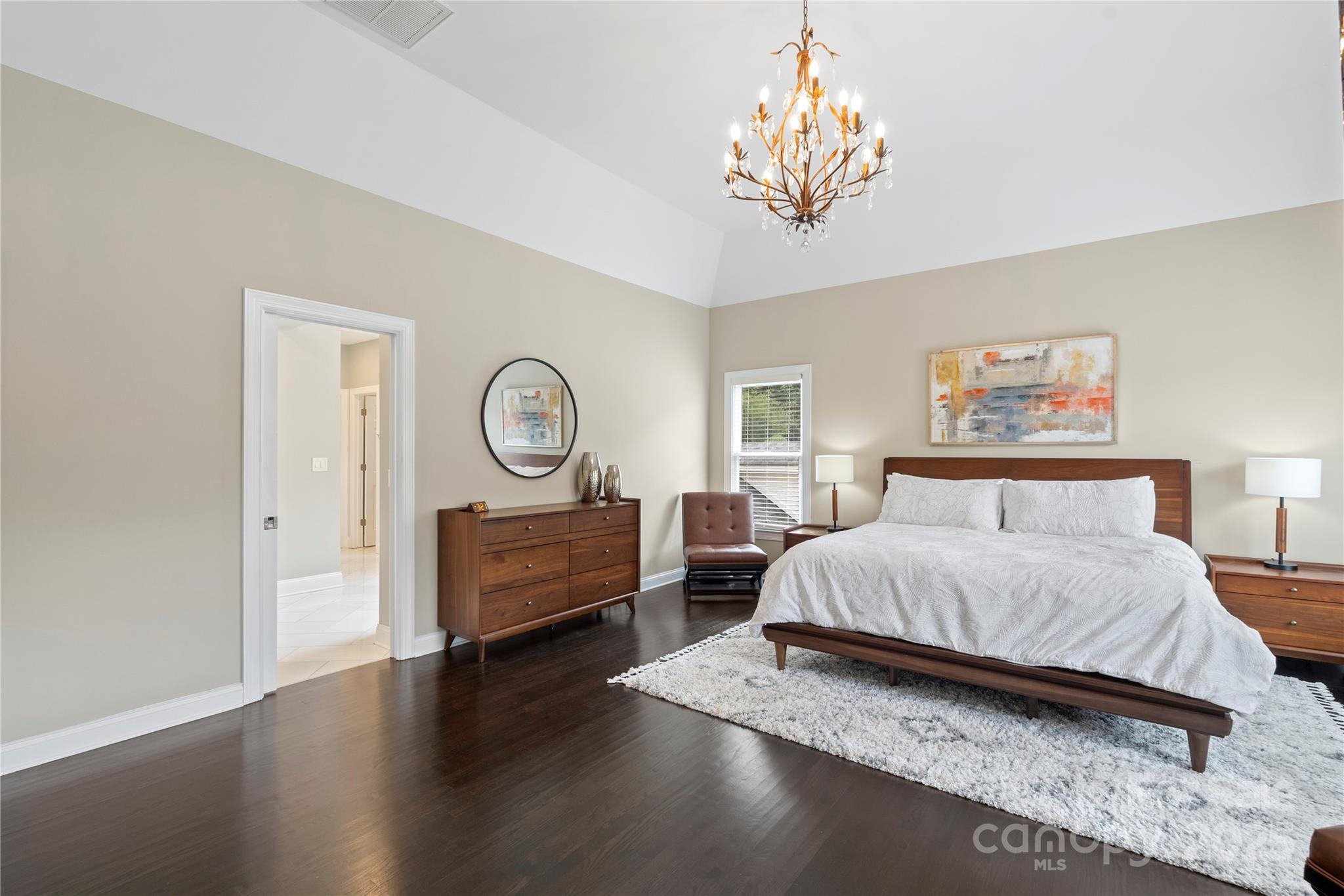 14654 Trading Path Way Charlotte, NC 28277 - Photo 27 of 48 a bedroom with a bed and a chandelier