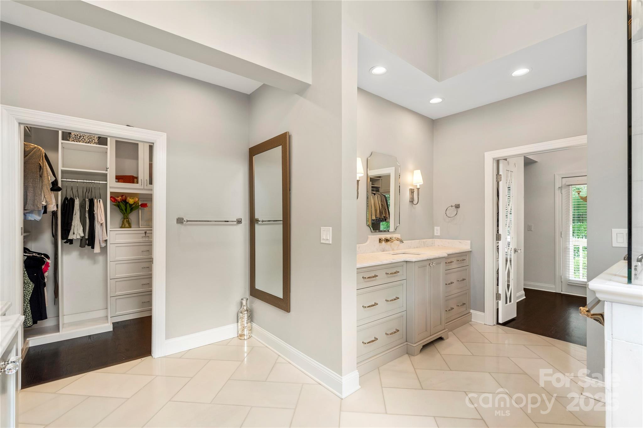 14654 Trading Path Way Charlotte, NC 28277 - Photo 32 of 48 a bathroom with a sink a mirror and a shower