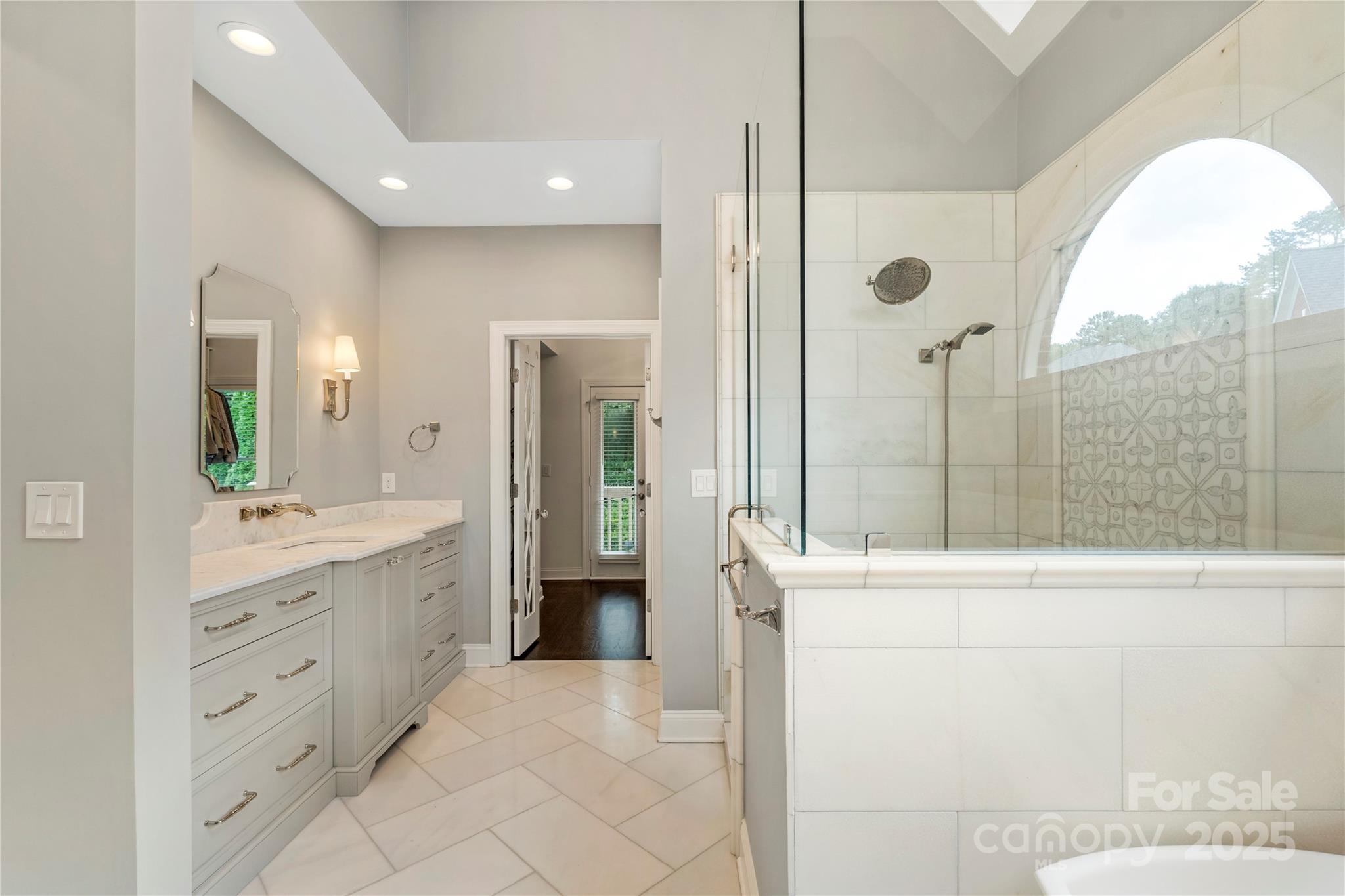 14654 Trading Path Way Charlotte, NC 28277 - Photo 33 of 48 a bathroom with a double vanity sink toilet and shower