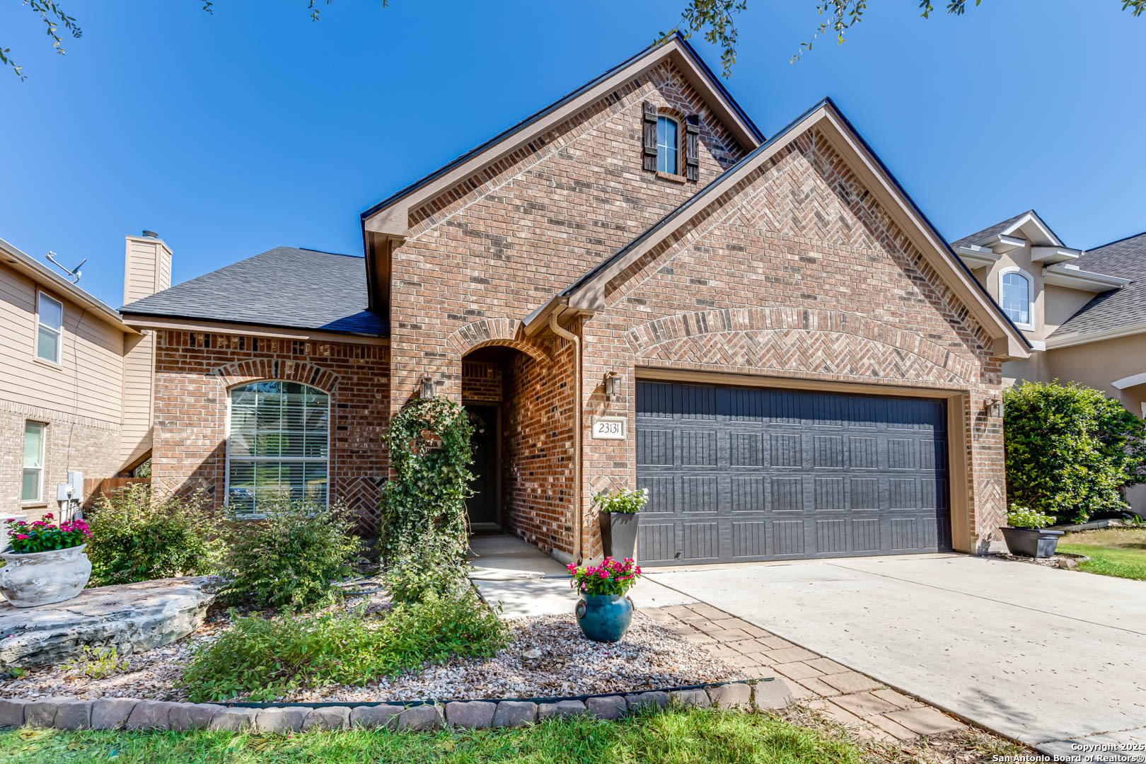 a front view of a house with garage
