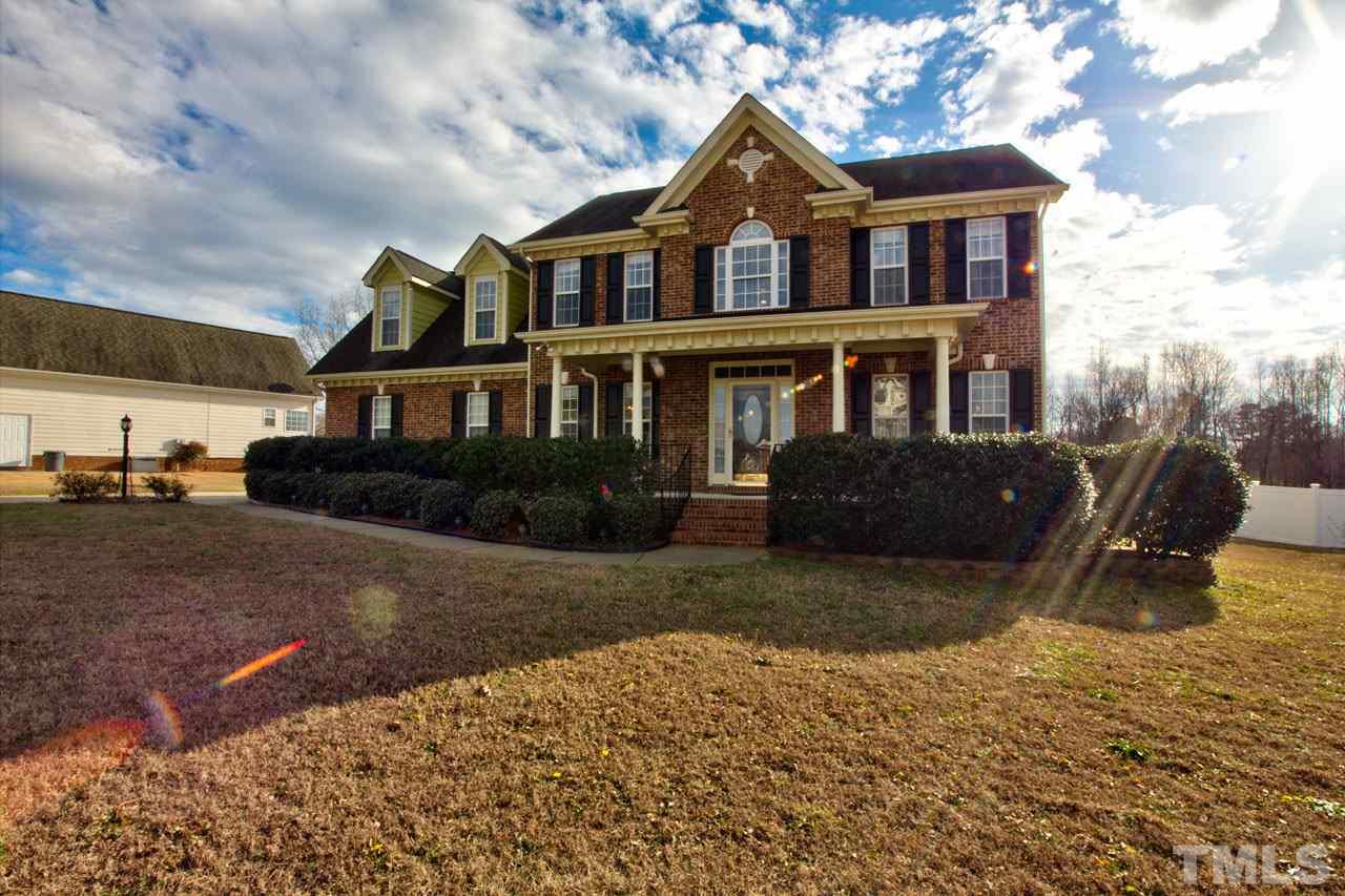 1021 Newburgh Circle Raleigh, NC 27603 - Photo 1 of 25 a front view of a house with a yard