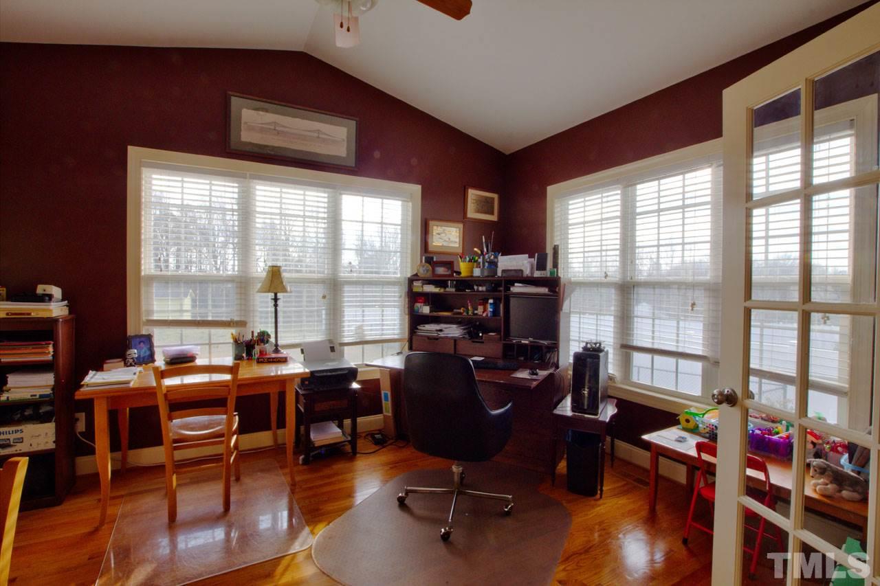 1021 Newburgh Circle Raleigh, NC 27603 - Photo 13 of 25 a view of a workspace with furniture and a window