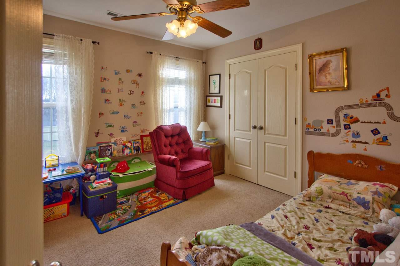 1021 Newburgh Circle Raleigh, NC 27603 - Photo 20 of 25 a bedroom with bed and a window
