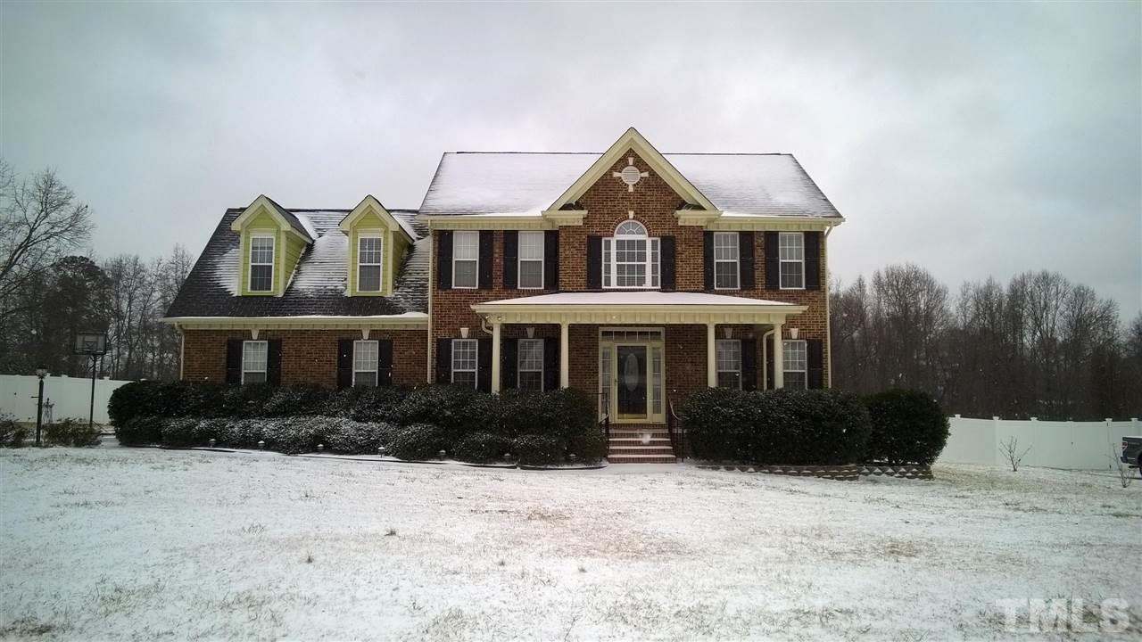 1021 Newburgh Circle Raleigh, NC 27603 - Photo 3 of 25 a front view of a house with garden