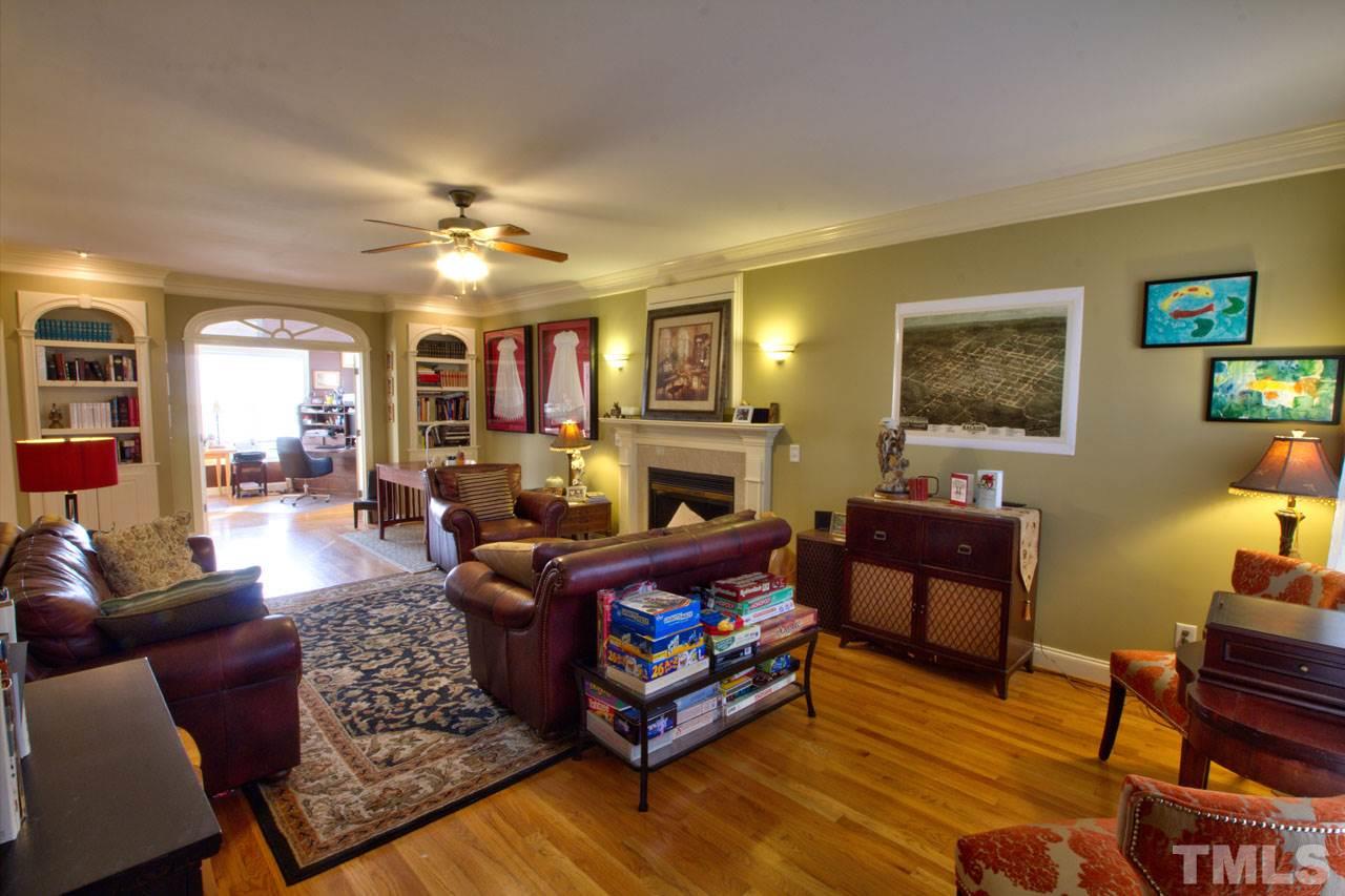 1021 Newburgh Circle Raleigh, NC 27603 - Photo 5 of 25 a living room with furniture fireplace and a window