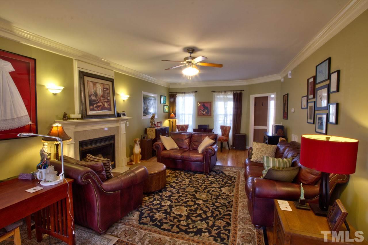 1021 Newburgh Circle Raleigh, NC 27603 - Photo 6 of 25 a living room with furniture a fireplace