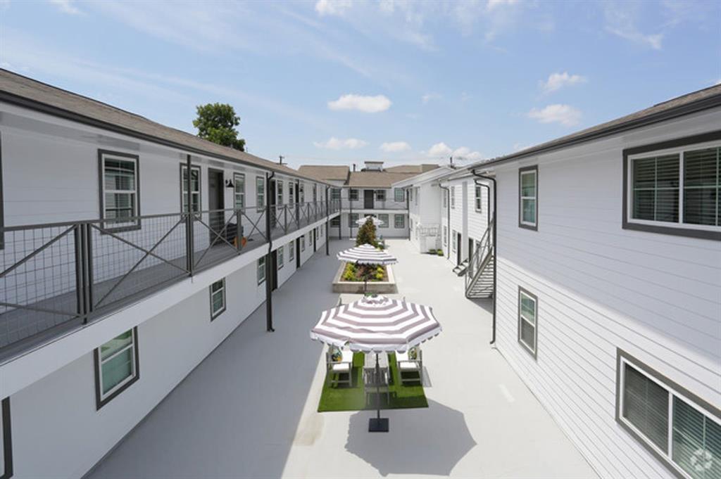 4633 Fairmount Street, Unit 110 Dallas, TX 75219 - Photo 13 of 13 a living room with furniture and a wooden floor