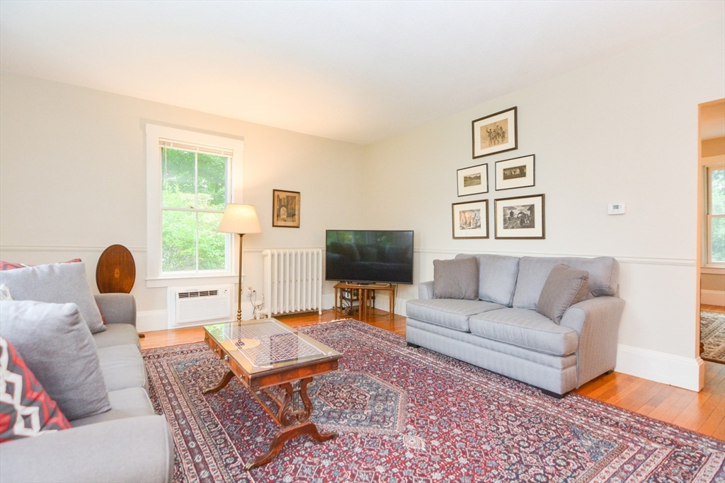 37 Pemberton Road Wayland, MA 01778 - Photo 12 of 34 a living room with furniture and a flat screen tv