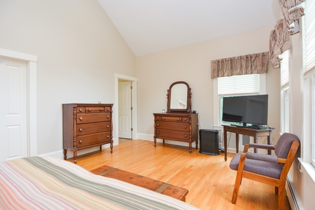 37 Pemberton Road Wayland, MA 01778 - Photo 20 of 34 a bedroom with furniture and a flat screen tv