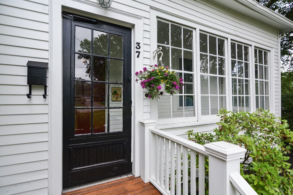 37 Pemberton Road Wayland, MA 01778 - Photo 2 of 34 a view of a house with a window and wooden fence