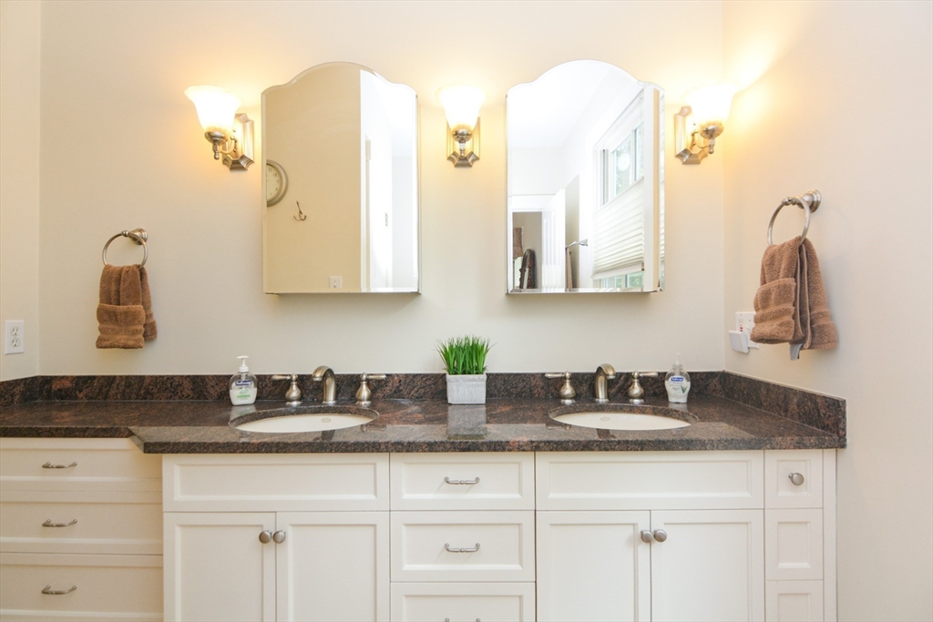 37 Pemberton Road Wayland, MA 01778 - Photo 22 of 34 a bathroom with sink two mirror and vanity
