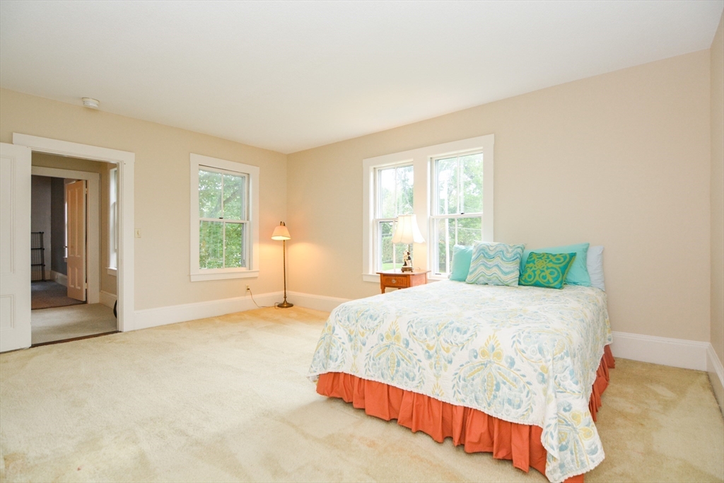 37 Pemberton Road Wayland, MA 01778 - Photo 25 of 34 a bedroom with a bed and a cabinets
