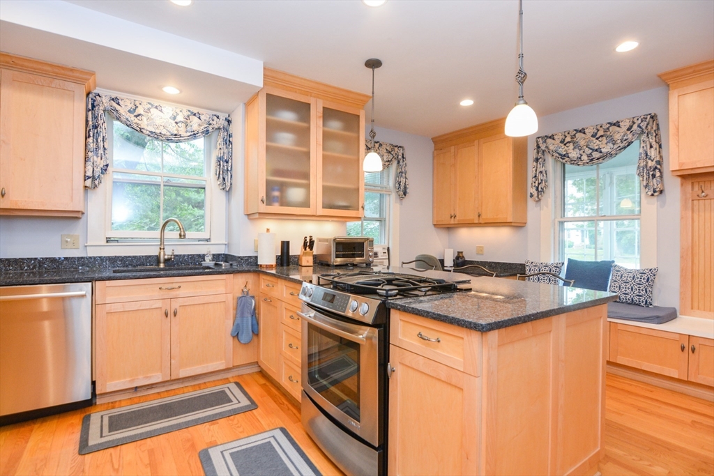 37 Pemberton Road Wayland, MA 01778 - Photo 6 of 34 a kitchen with stainless steel appliances granite countertop a stove a sink and a microwave