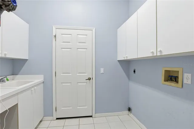 a view of a storage and utility room with washer and dryer