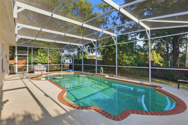 a view of a backyard with table and chairs