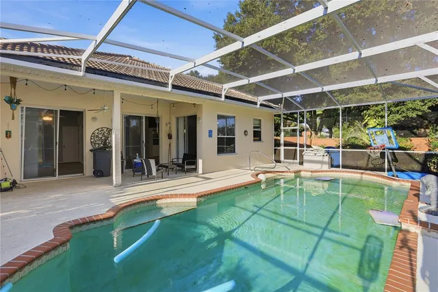 a view of a backyard with a swimming pool