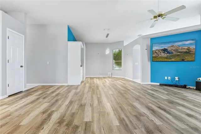 a view of a bedroom with a bed and a chandelier