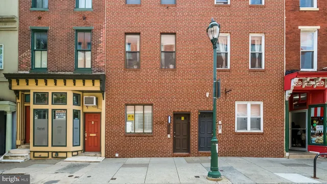 a kitchen with a stove and a refrigerator