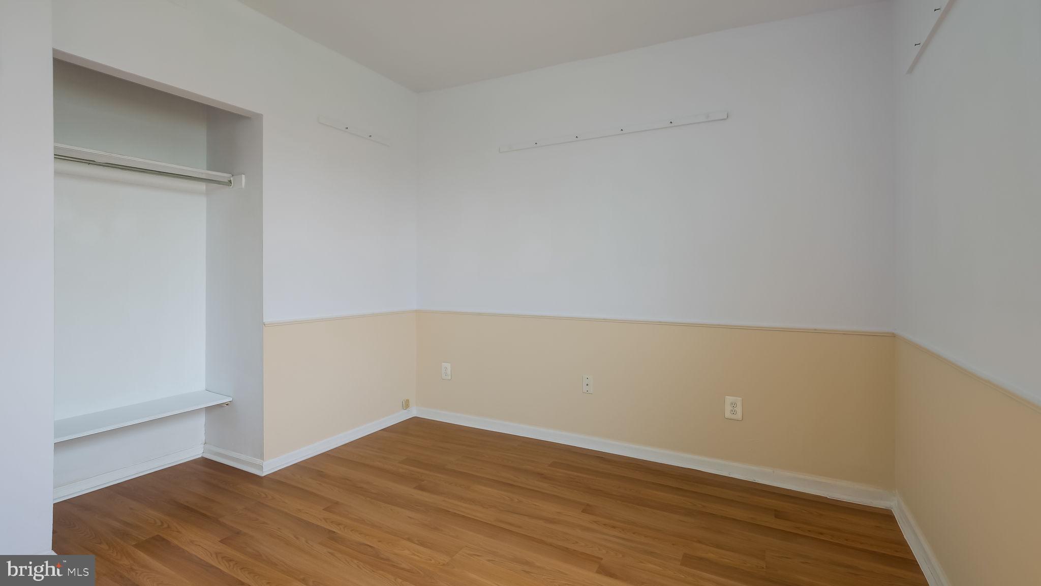 2120 South Street, Unit 2RE Philadelphia, PA 19146 - Photo 17 of 20 an empty room with wooden floor