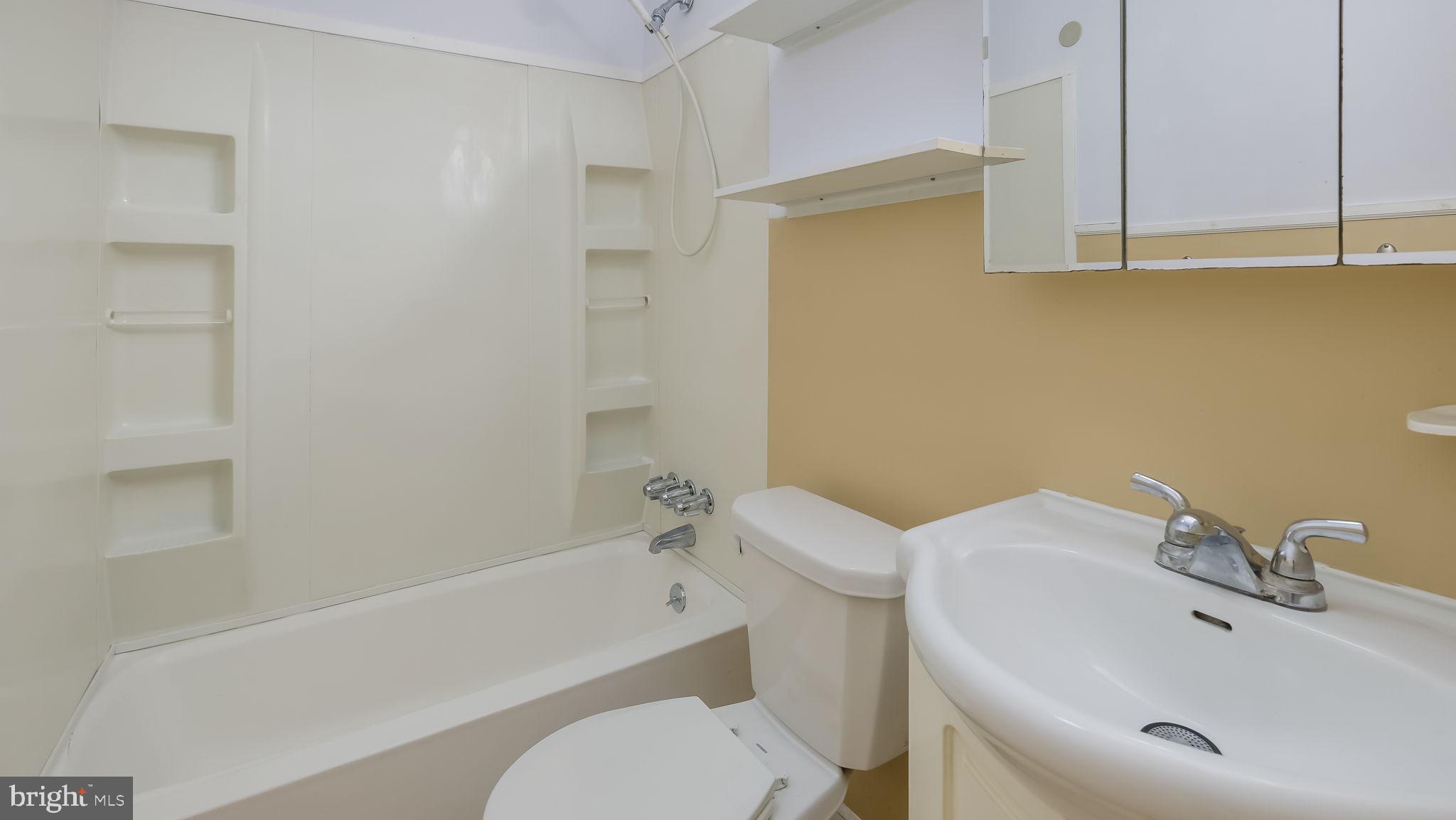 2120 South Street, Unit 2RE Philadelphia, PA 19146 - Photo 20 of 20 a bathroom with a sink toilet and bathtub
