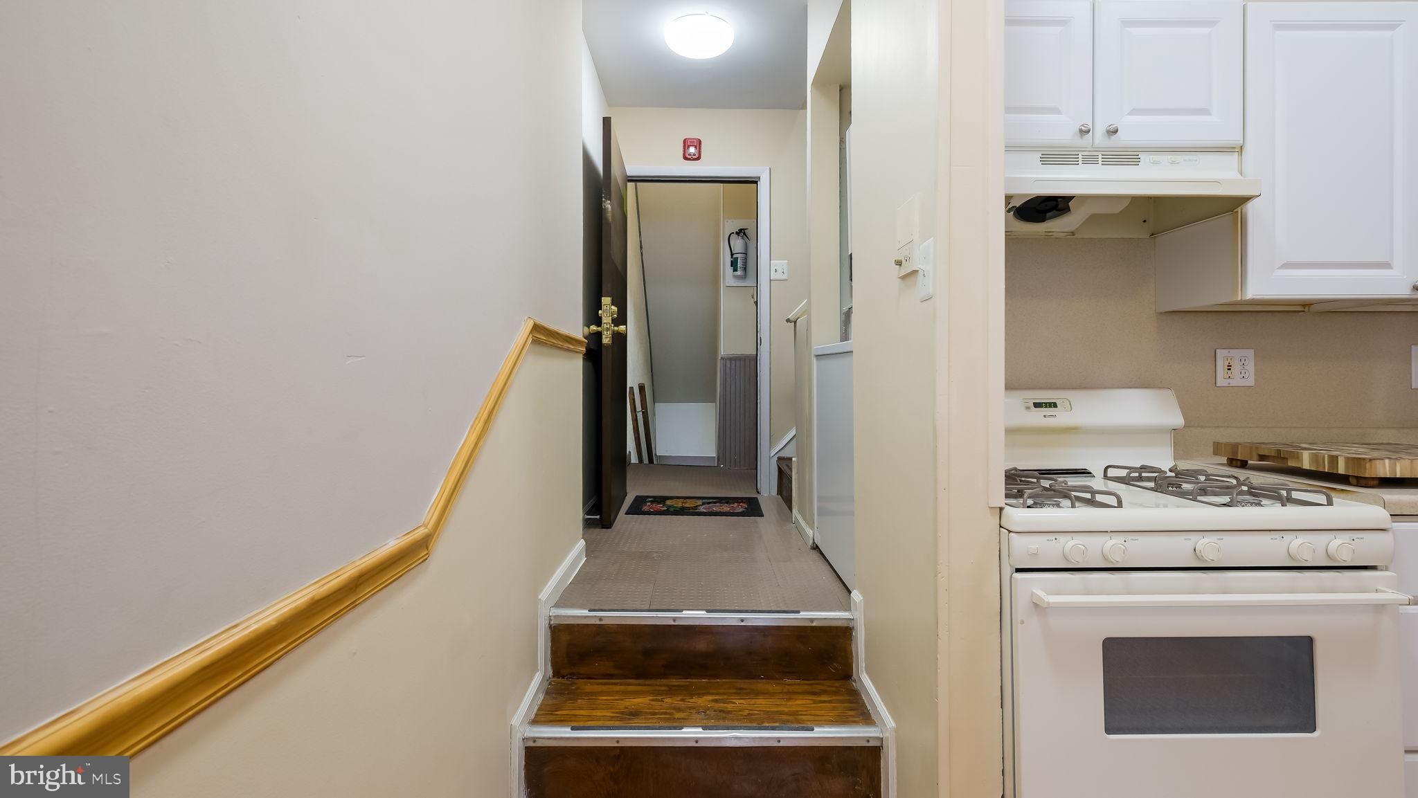 2120 South Street, Unit 2RE Philadelphia, PA 19146 - Photo 2 of 20 a kitchen with a stove and a refrigerator