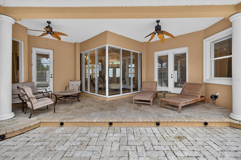 9427 Eddings Road Odessa, FL 33556 - Photo 66 of 93 a view of a patio with a table and chairs