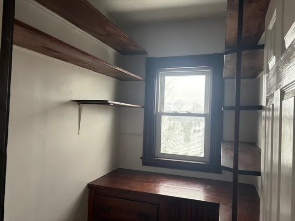 a view of empty room with windows