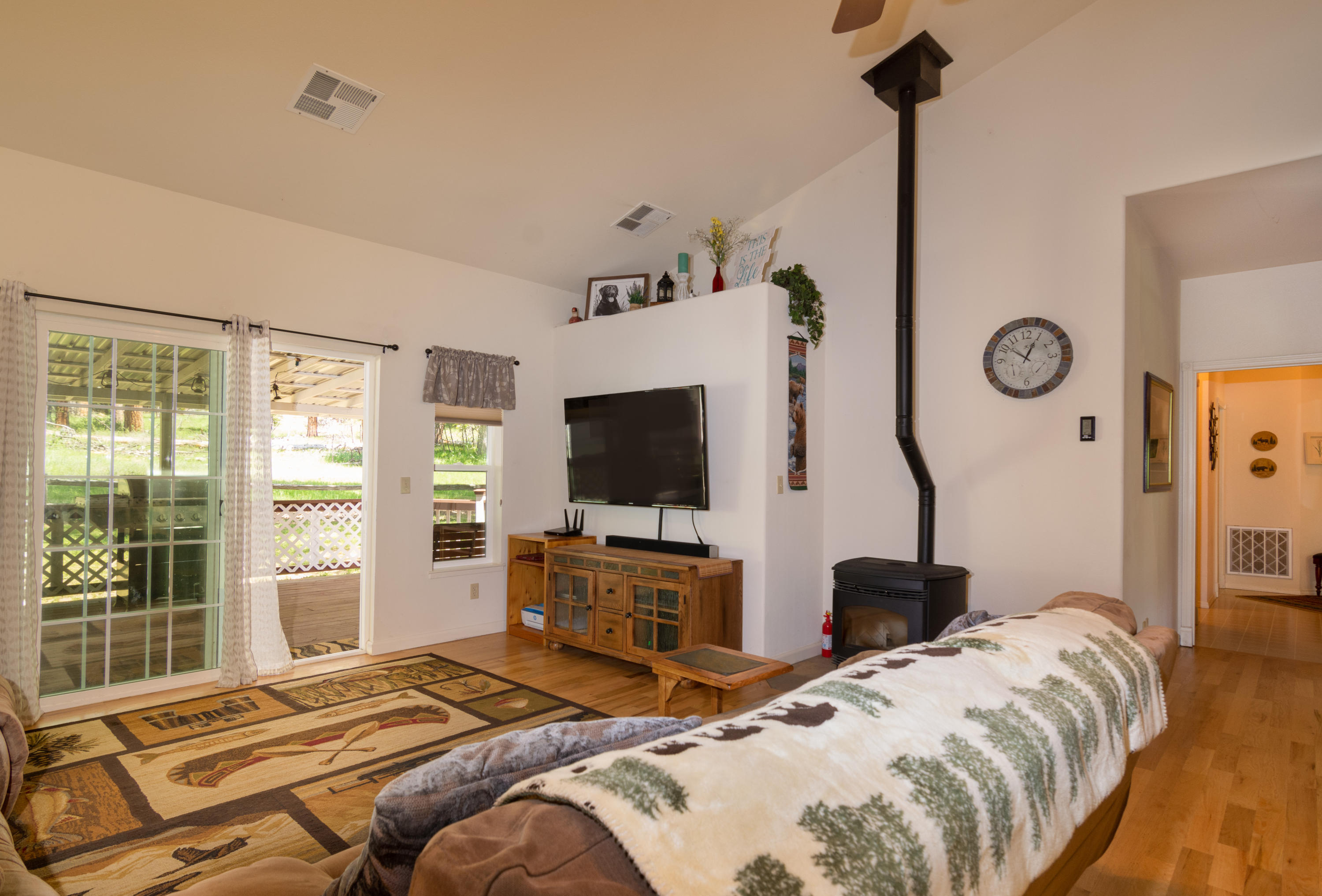 320 Salt Flat Road Lewiston, CA 96052 - Photo 11 of 32 a bedroom with a bed and a flat tv screen