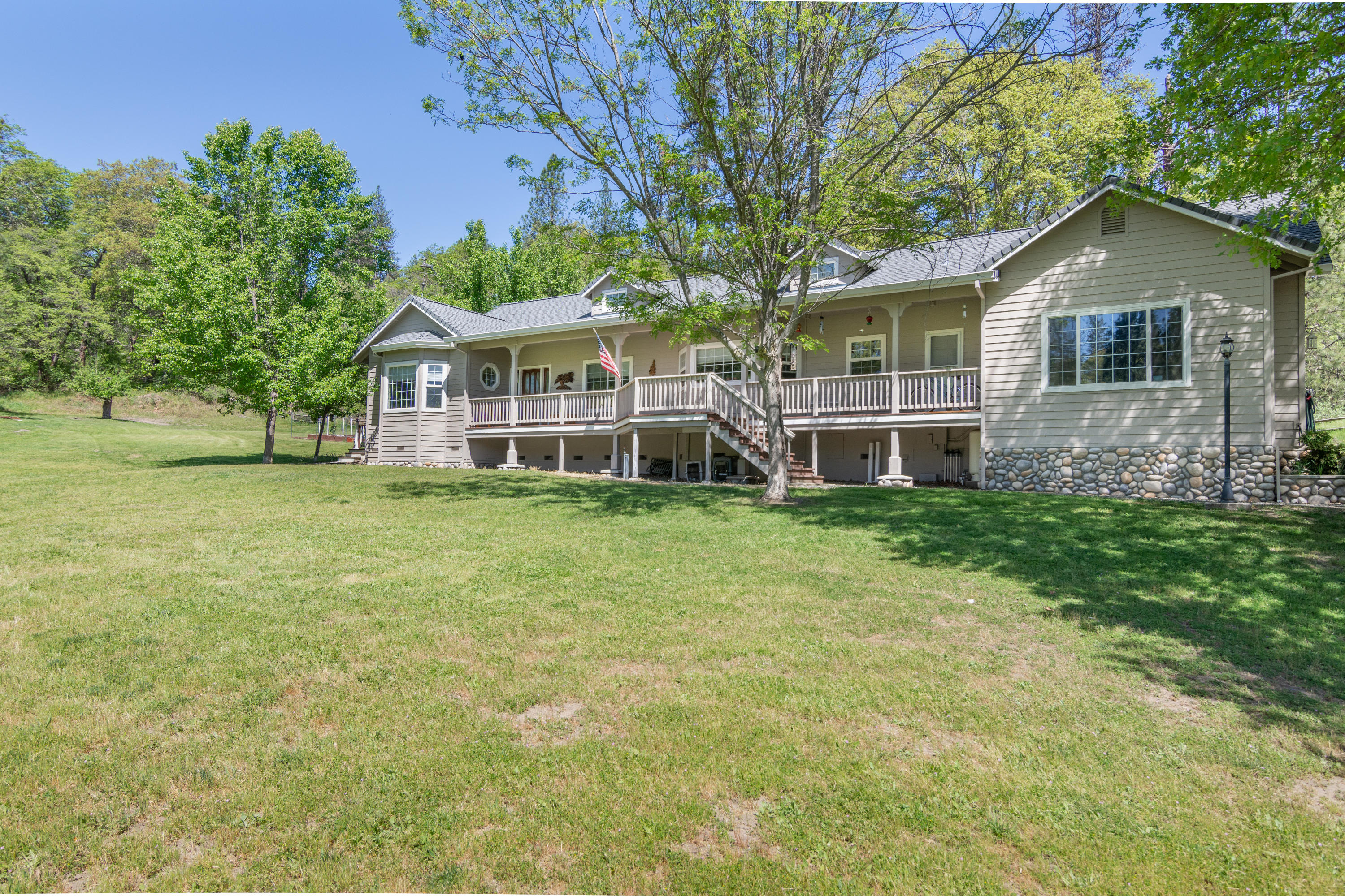 320 Salt Flat Road Lewiston, CA 96052 - Photo 2 of 32 a front view of a house with a garden and trees