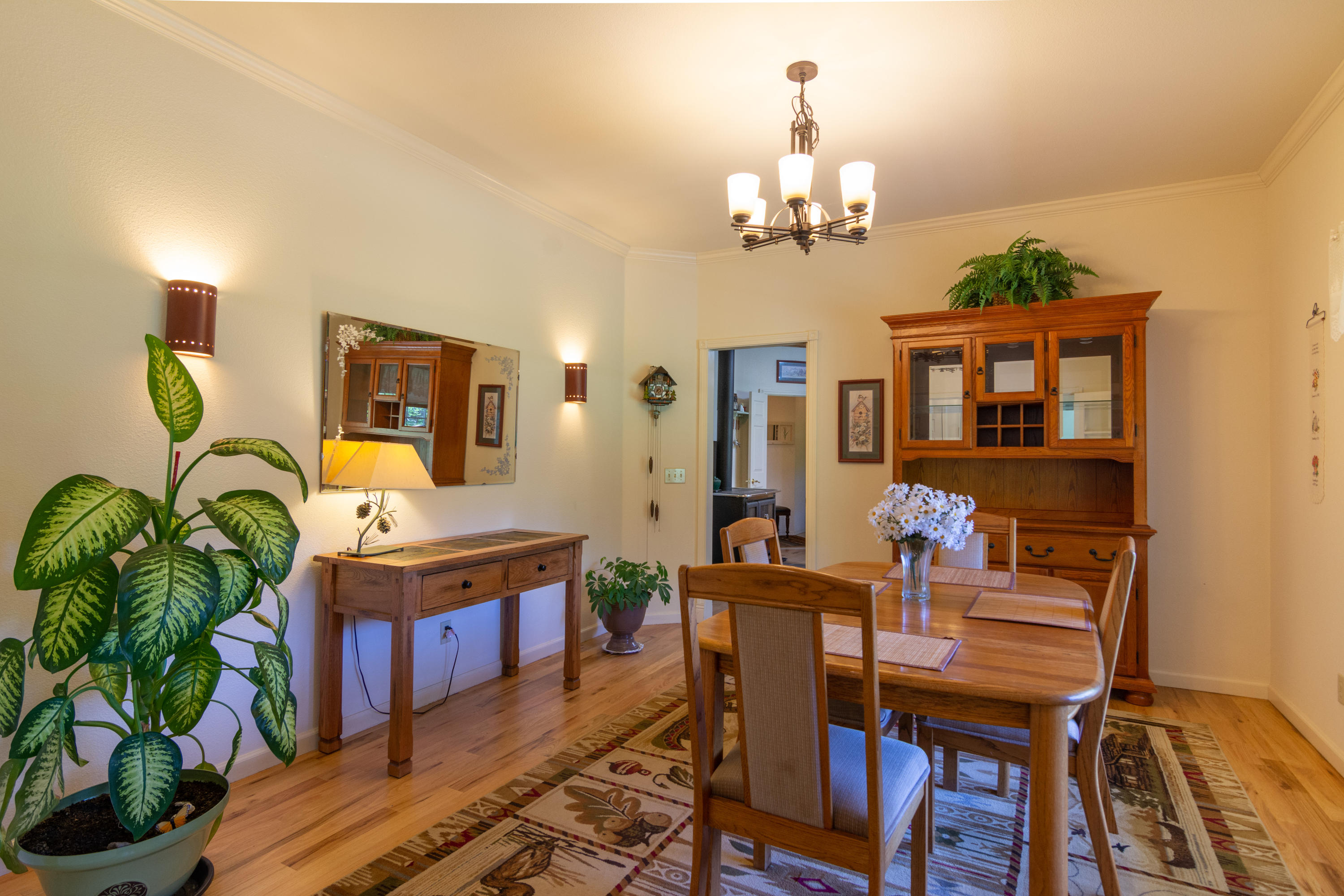 320 Salt Flat Road Lewiston, CA 96052 - Photo 9 of 32 a view of a dining room with furniture and chandelier