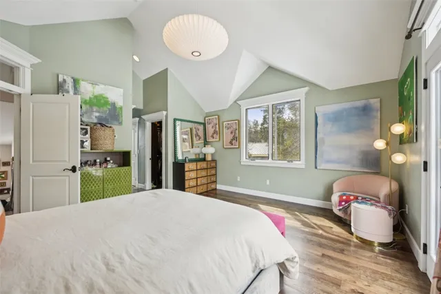 a living room with furniture and painting on the wall