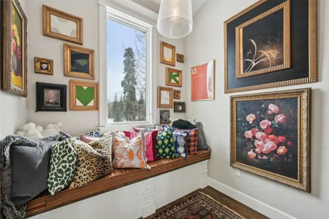 a en suite bathroom with a granite countertop sink and a window