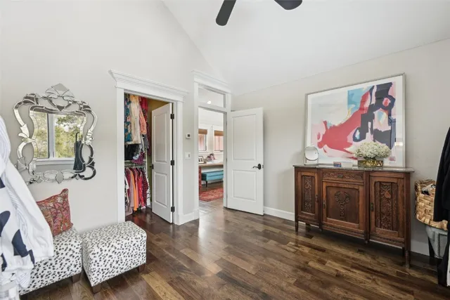 a bathroom with a granite countertop sink mirror and a toilet