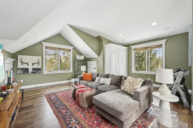 a view of an entryway with wooden floor and door