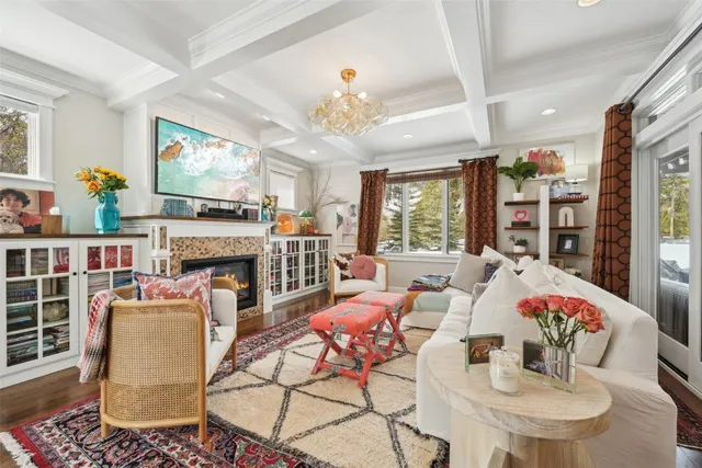 a living room with fireplace furniture and a flat screen tv