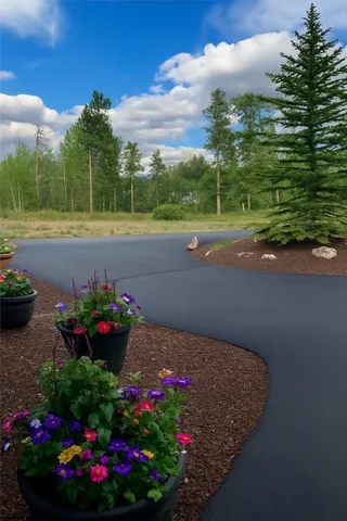 a view of a chair and table in backyard