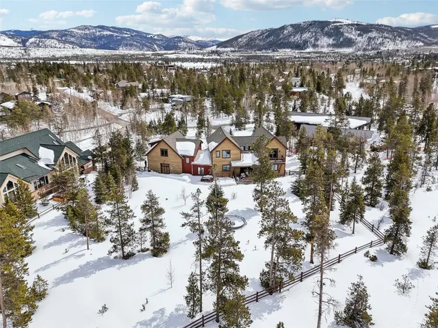 a front view of house with trees all around