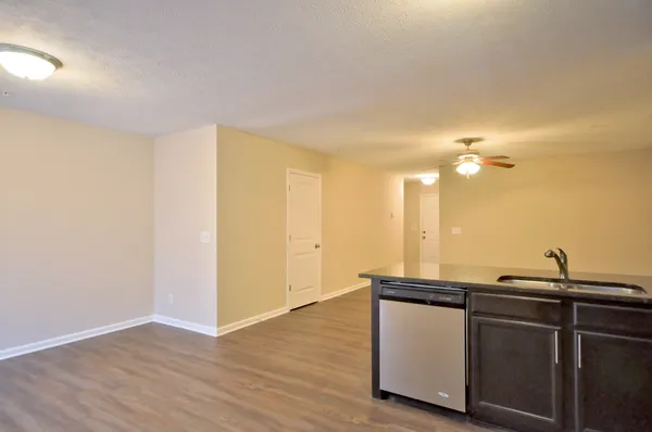 a kitchen with a sink and cabinets