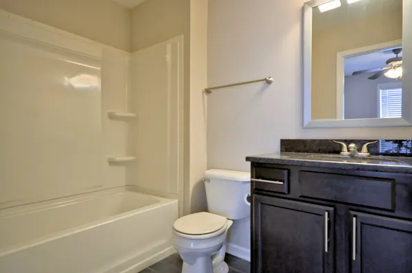 a bathroom with a sink toilet and a bathtub