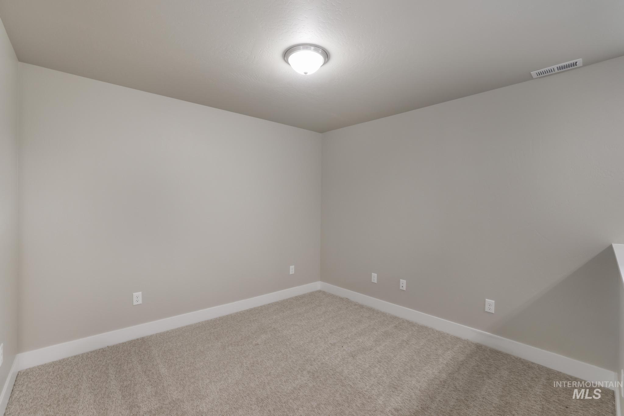 812 Jack Avenue Jerome, ID 83338 - Photo 18 of 38 Unfurnished room with baseboards and carpet floors