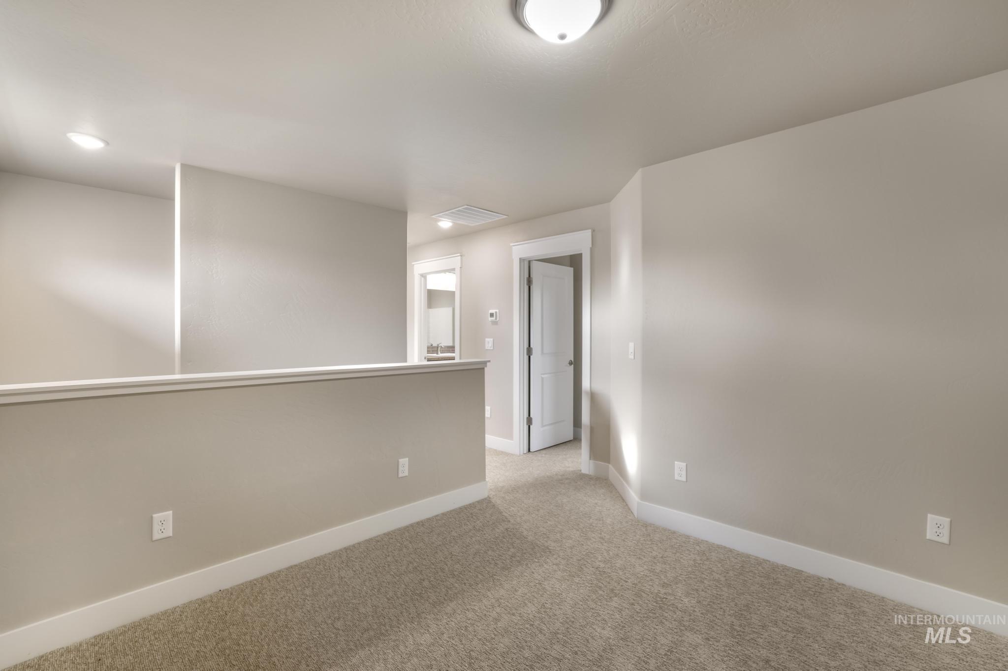 812 Jack Avenue Jerome, ID 83338 - Photo 19 of 38 Empty room with baseboards and light colored carpet