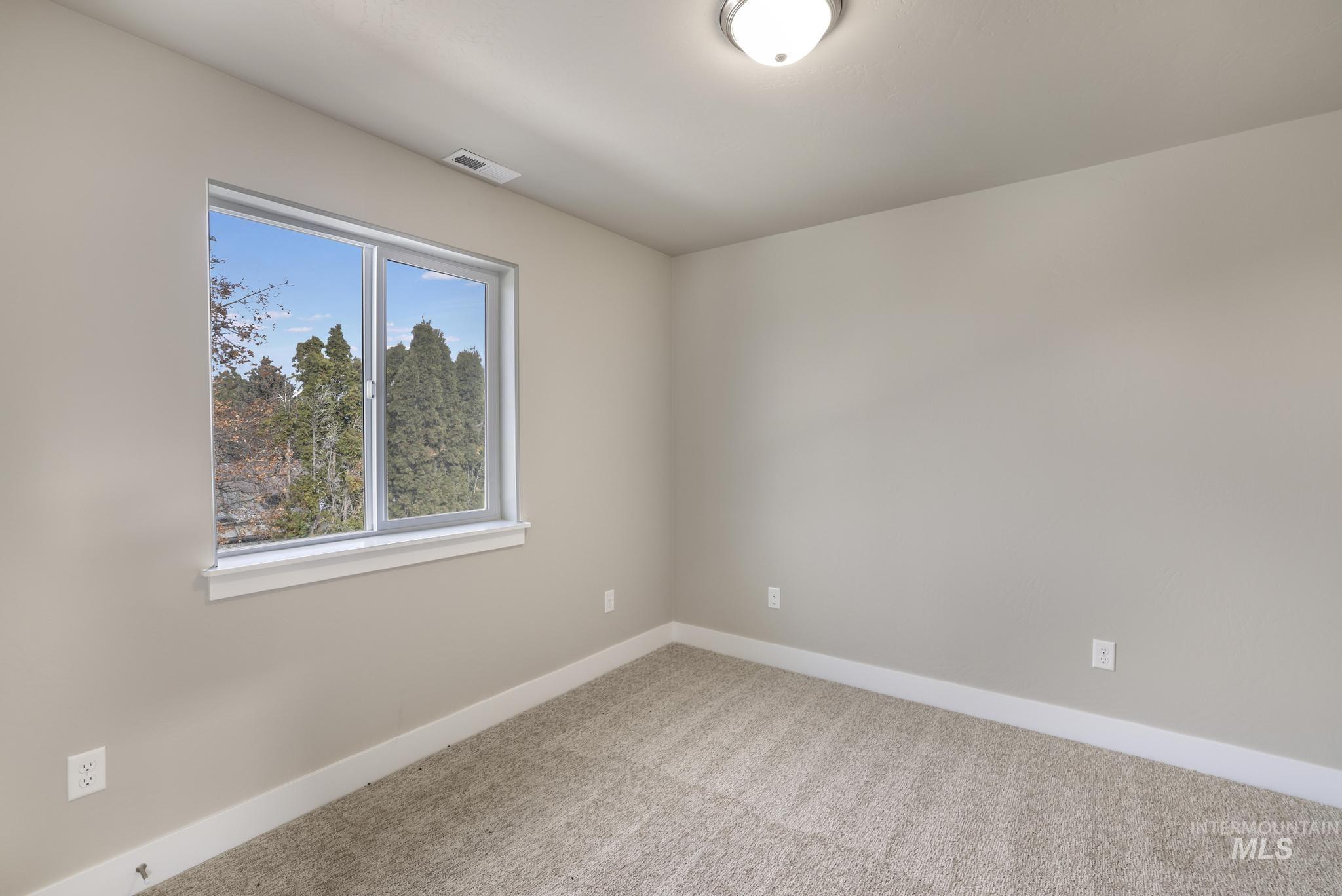 812 Jack Avenue Jerome, ID 83338 - Photo 20 of 38 Unfurnished room with baseboards and carpet floors
