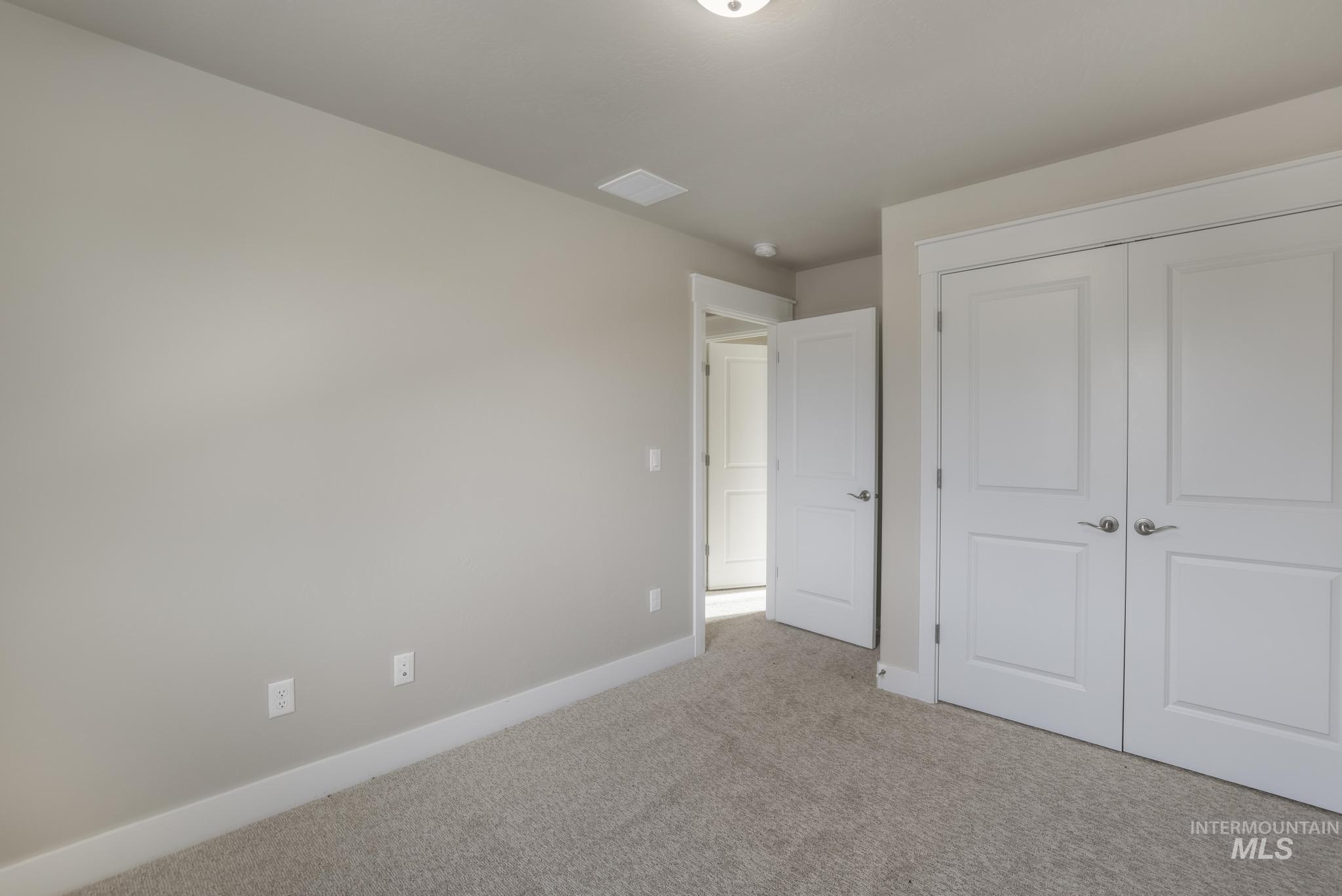 812 Jack Avenue Jerome, ID 83338 - Photo 24 of 38 Unfurnished bedroom with carpet flooring and a closet
