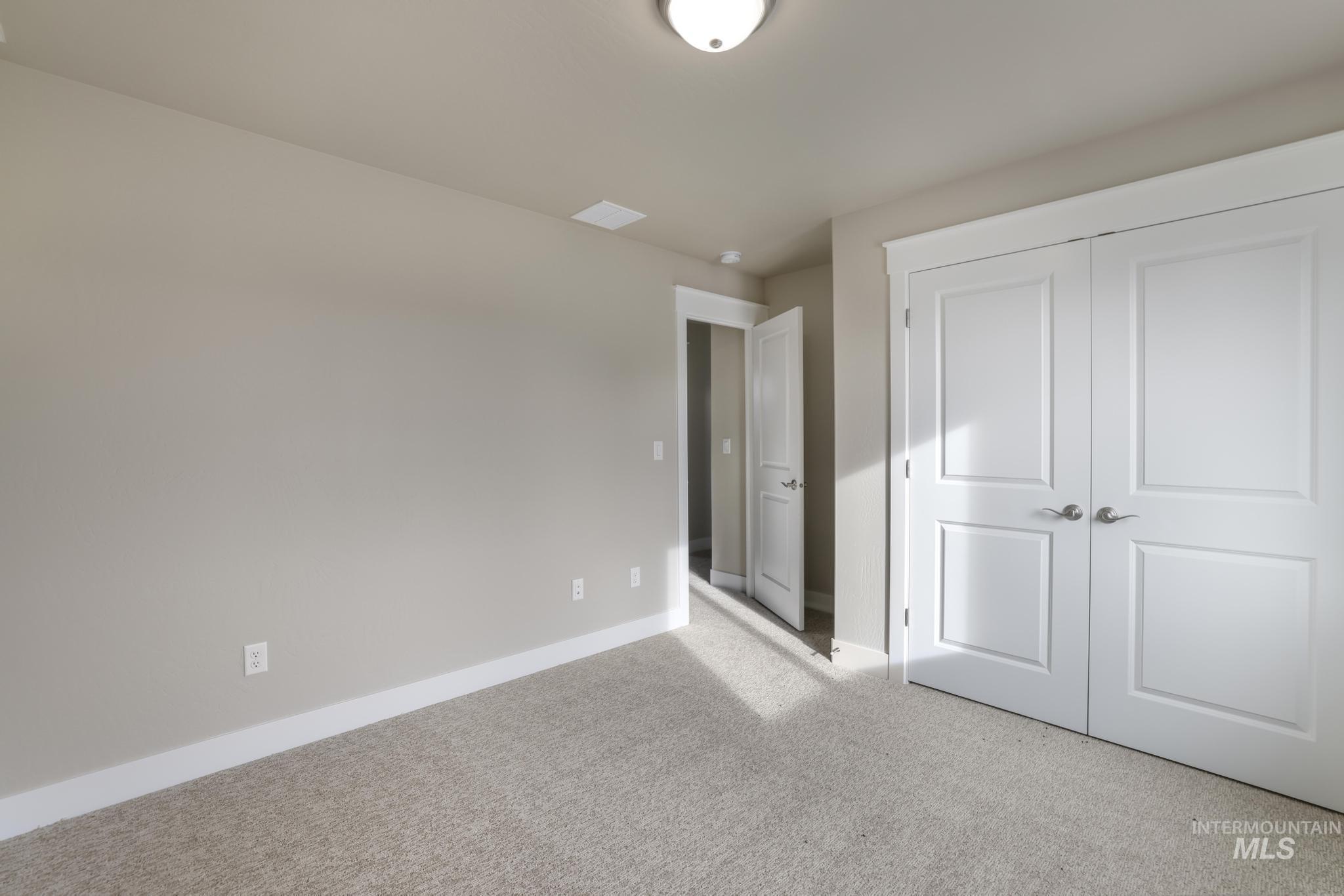 812 Jack Avenue Jerome, ID 83338 - Photo 26 of 38 Unfurnished bedroom with carpet floors and a closet
