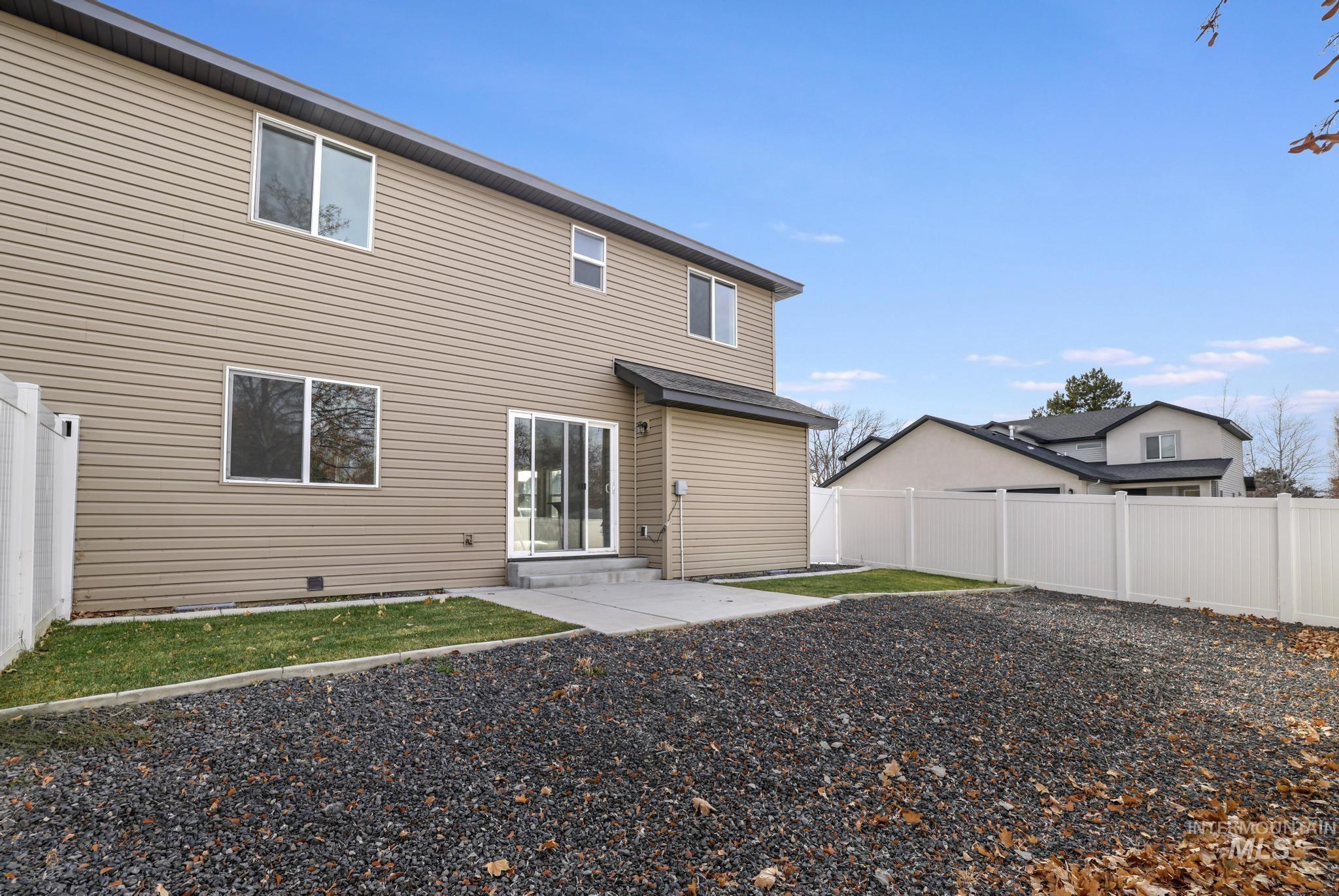 812 Jack Avenue Jerome, ID 83338 - Photo 27 of 38 Back of house with a fenced backyard and entry steps