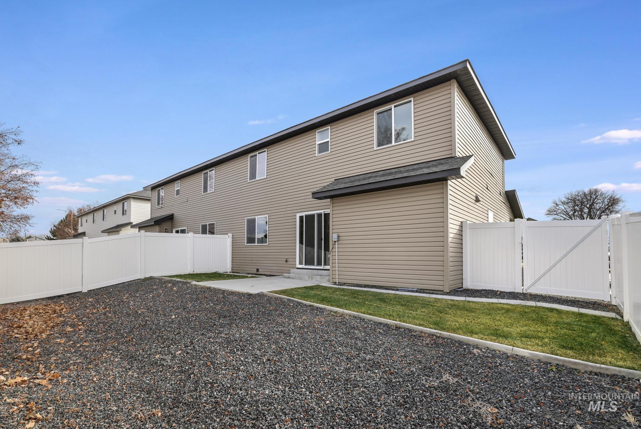 812 Jack Avenue Jerome, ID 83338 - Photo 28 of 38 Back of property featuring a fenced backyard and a gate