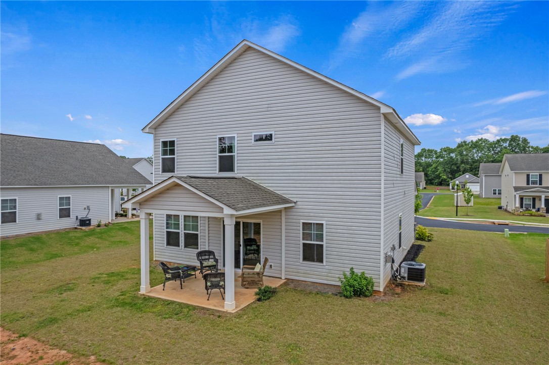 122 Bellflower Lane Anderson, SC 29625 - Photo 10 of 15 This newly constructed residence features a charming covered patio and spacious yard.