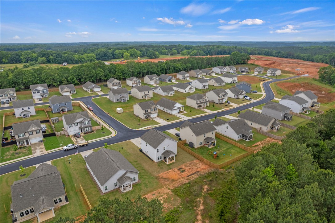 122 Bellflower Lane Anderson, SC 29625 - Photo 12 of 15 An aerial perspective reveals a vibrant community with houses nestled amidst green spaces.