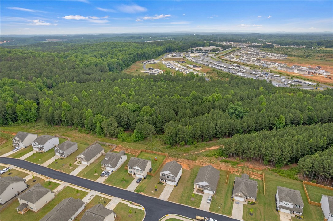 122 Bellflower Lane Anderson, SC 29625 - Photo 13 of 15 This elevated perspective reveals a residential community nestled beside a verdant forest, with ample green space.