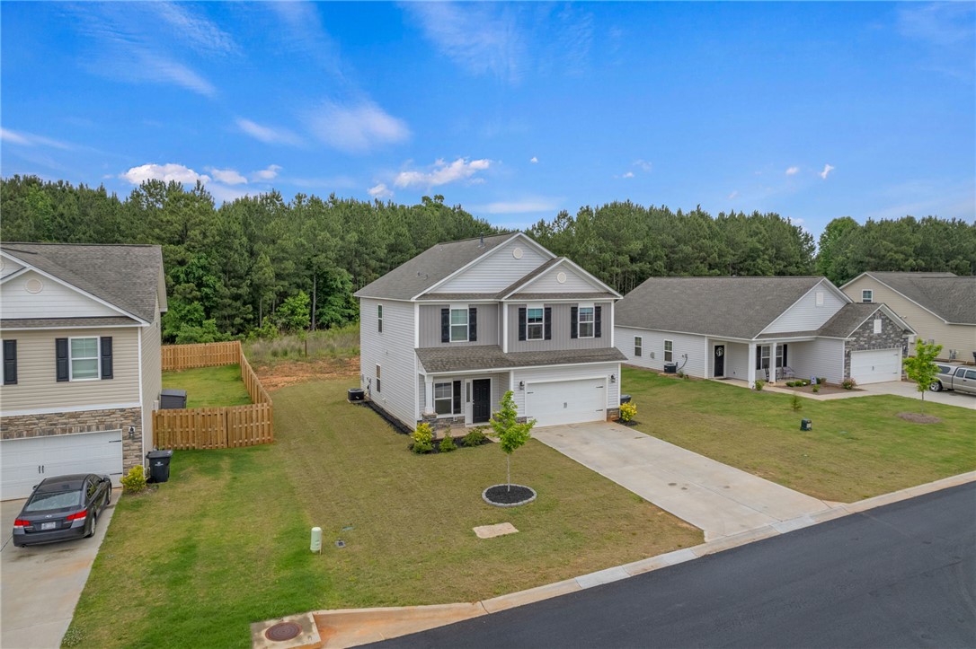 122 Bellflower Lane Anderson, SC 29625 - Photo 2 of 15 This newly built home features a spacious driveway and attached garage.